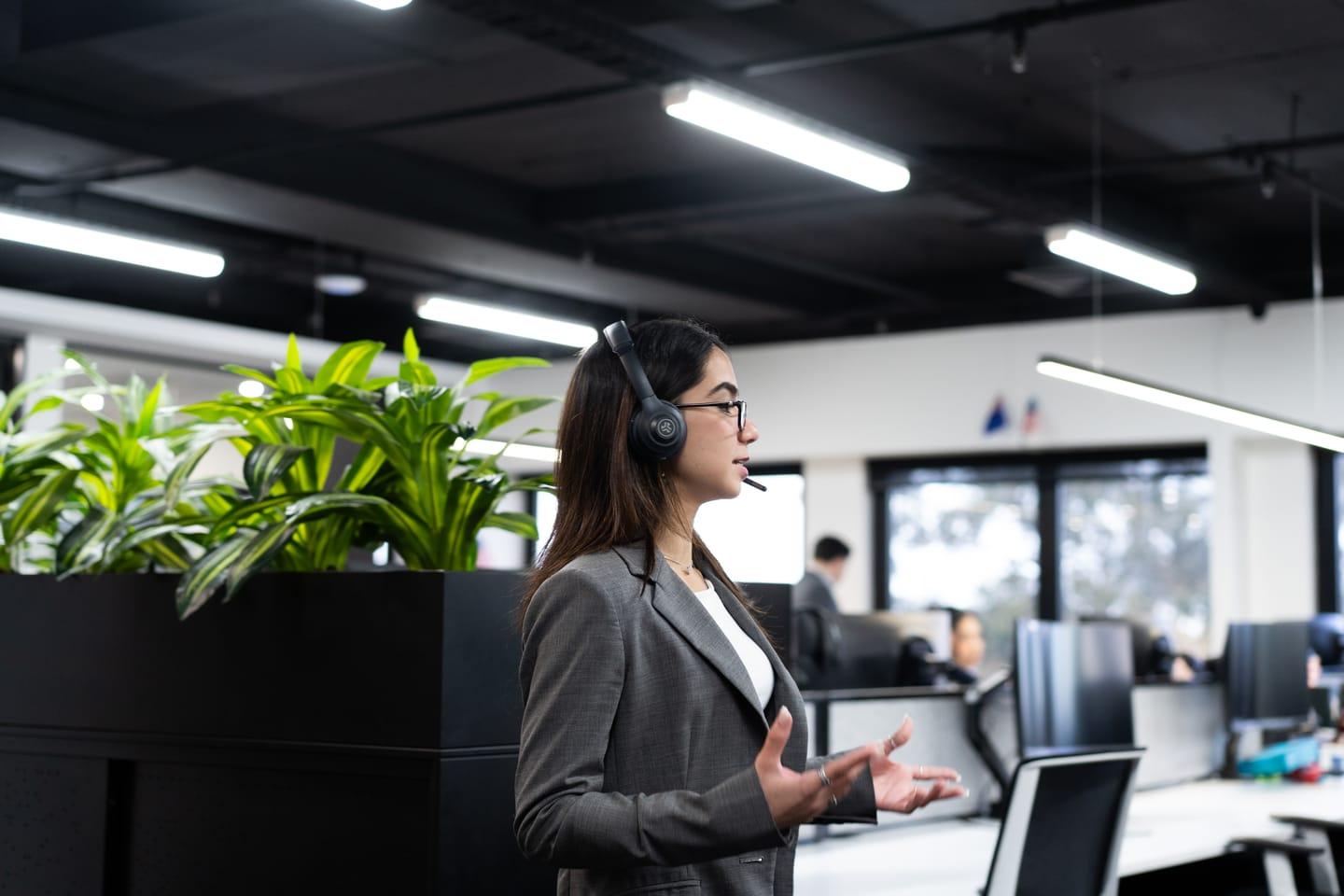 A Stormrake broker taking a client call on a headset at the trading desk